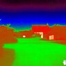Termovízny obraz z kamery FLIR SCOUT TK zobrazujúci krajinu s budovami a vegetáciou v rôznych farbách tepelného spektra.